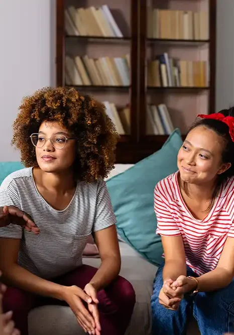 supportive-diverse-friends-smiling-listening-each-other-group-therapy-session copy